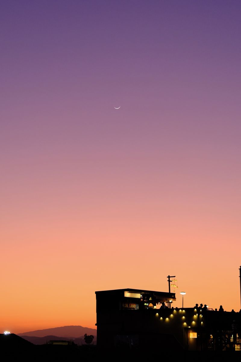 A photo after sunset with a colorful sky and a skybar in Chiang Mai